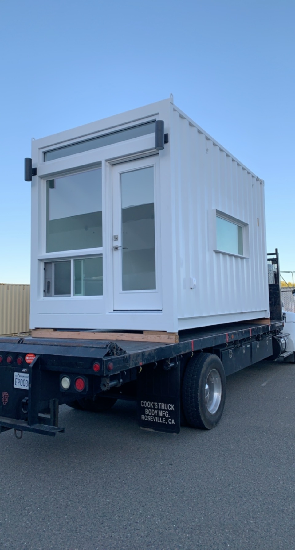 A prefabricated ADU on a trailer ready to be installed by RiseCon.